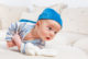 Tummy time adalah saat bayi dalam posisi tengkurap, terjaga, dan diawasi (Dok. Shutterstock)
